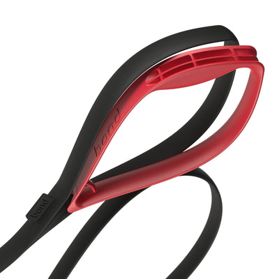 Red ergonomic grip being attached to dog leash